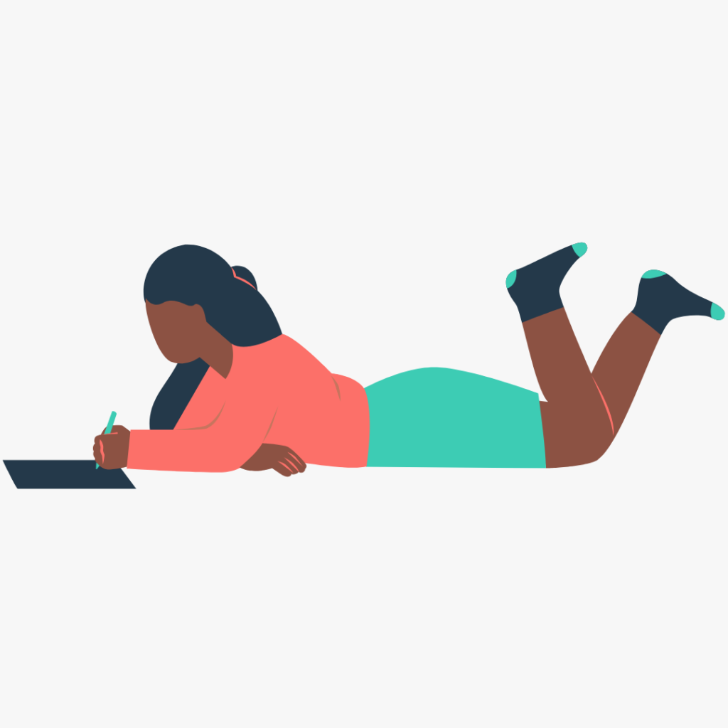 Woman ponders Yoga marketing ideas, laying on her stomach with notebook