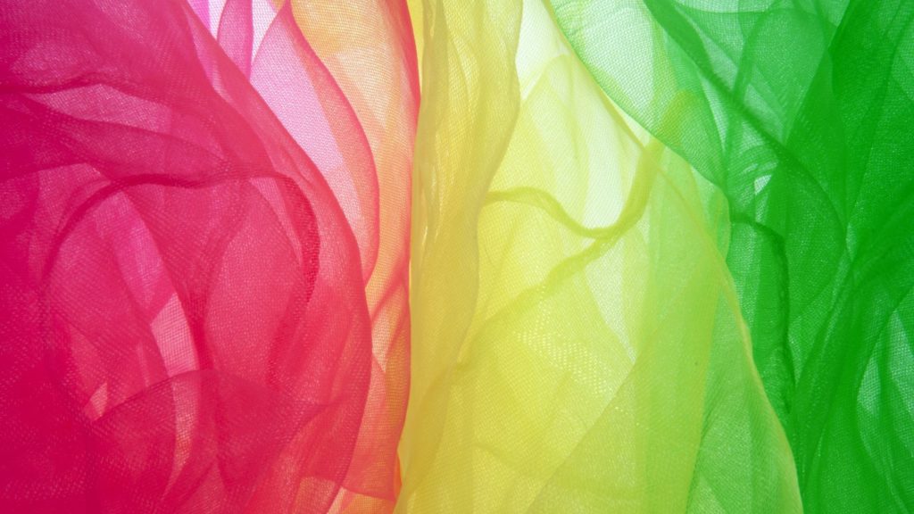 Three colourful transparent scarves in red, yellow and green